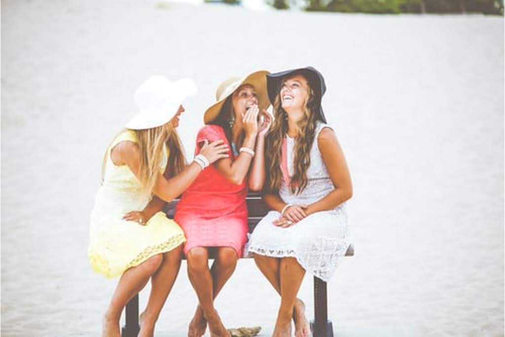 three girls having fun posing for a picture