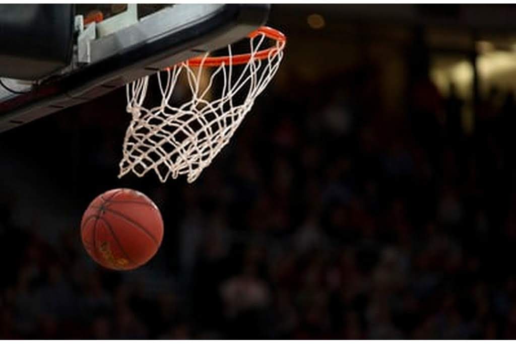 ball going through rim in a basketball game