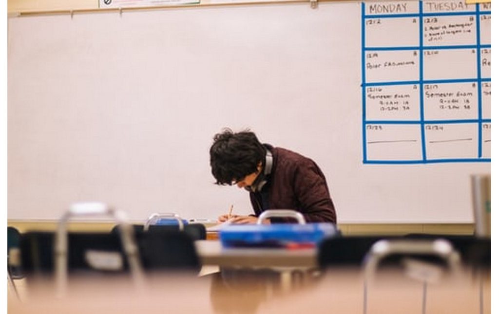 teacher cleaning classroom