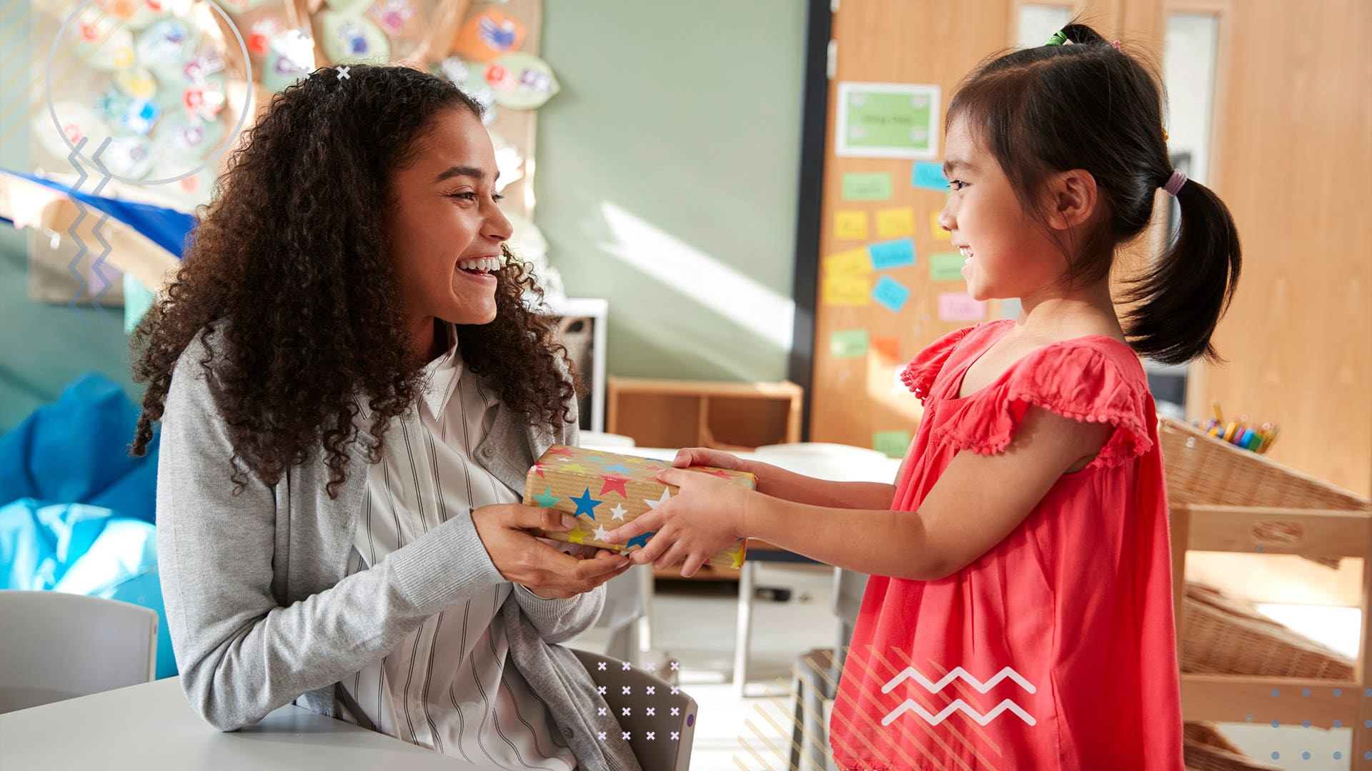 A student and teacher smiling in classroom