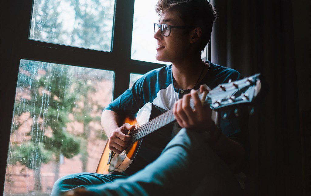 kid playing guitar