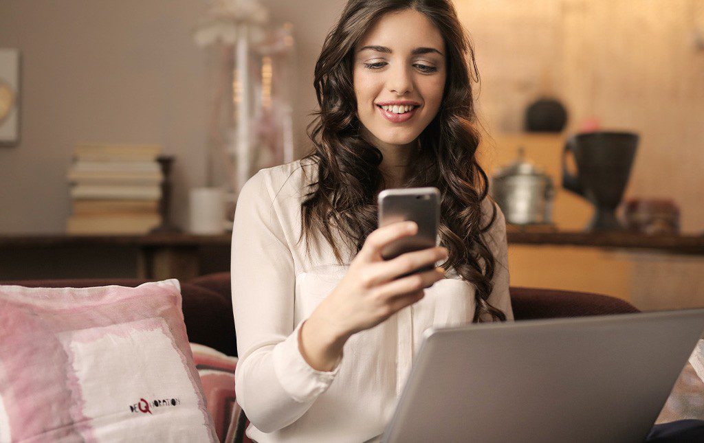 woman looking at her phone