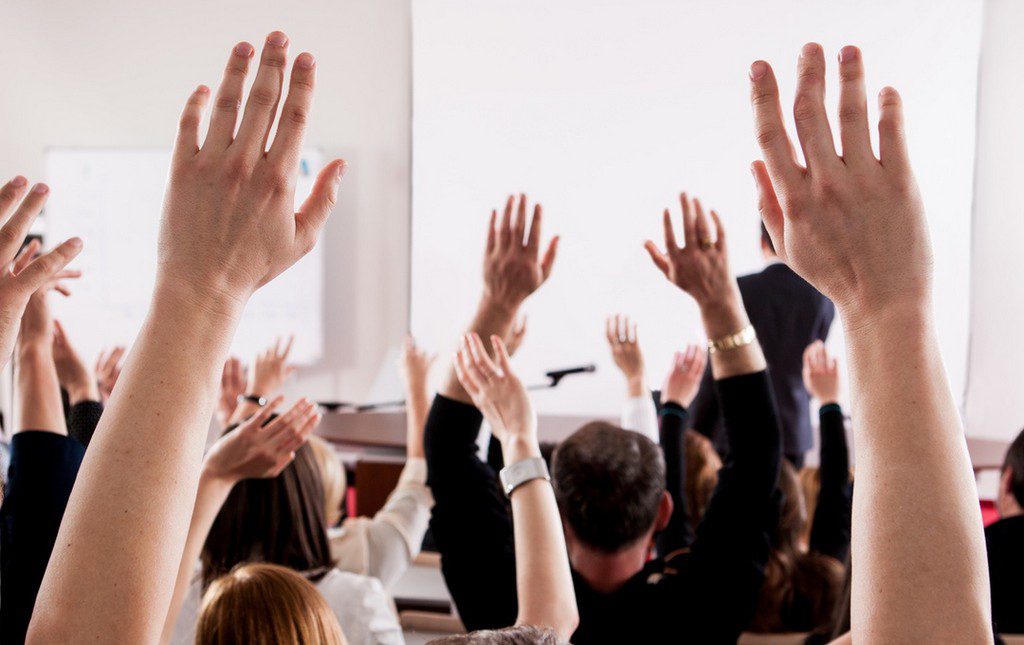 PTA meeting with parents asking questions about compliance matters