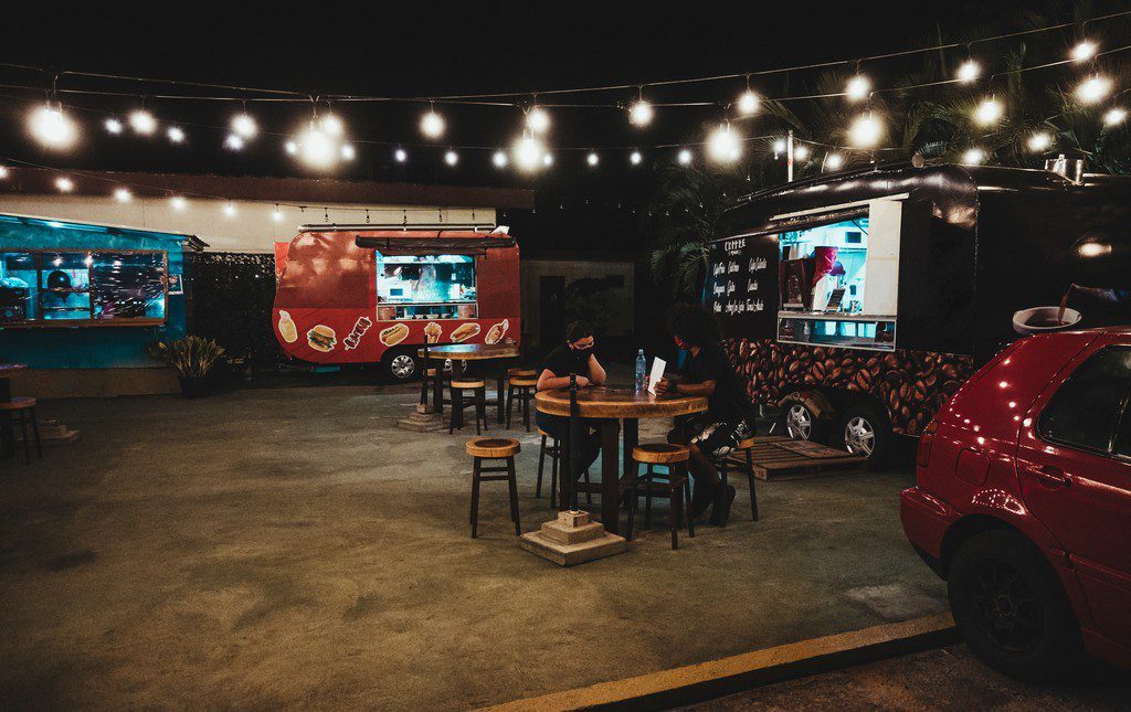 Couple enjoying a meal at a food truck festival