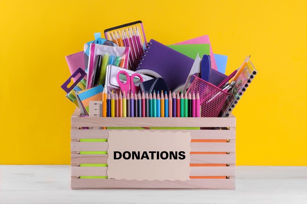 Box of school supplies for back to school supply drive fundraiser