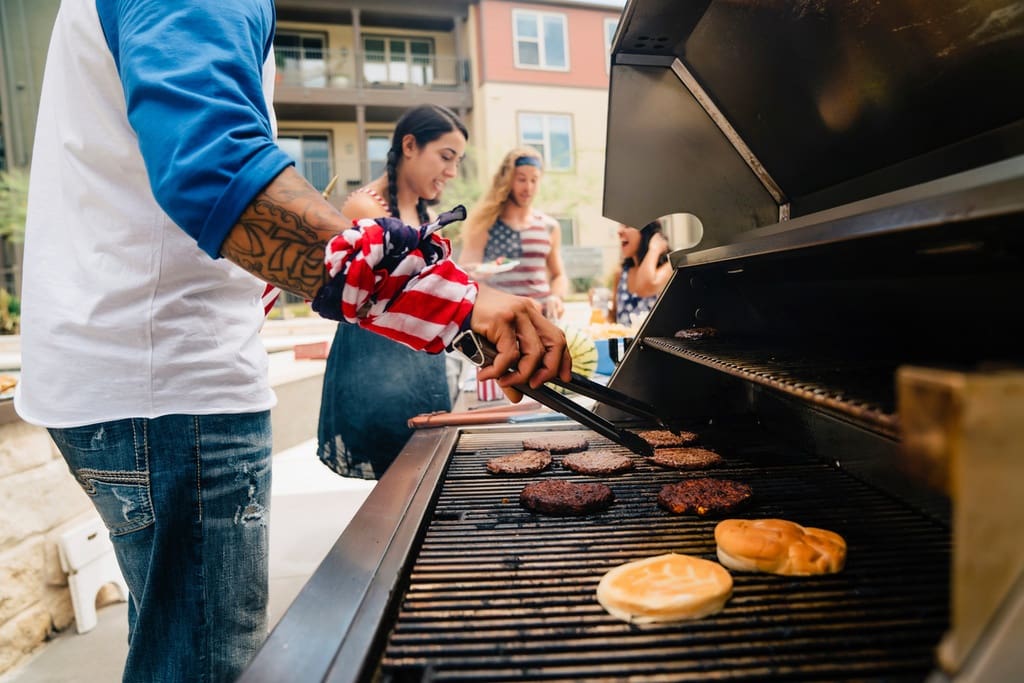 Students and parents at BBQ grill off fundraiser