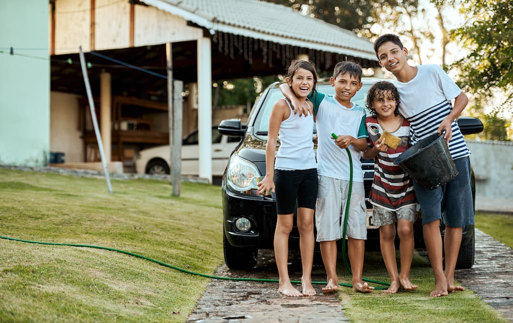 Students Washing Cars for a Car Wash