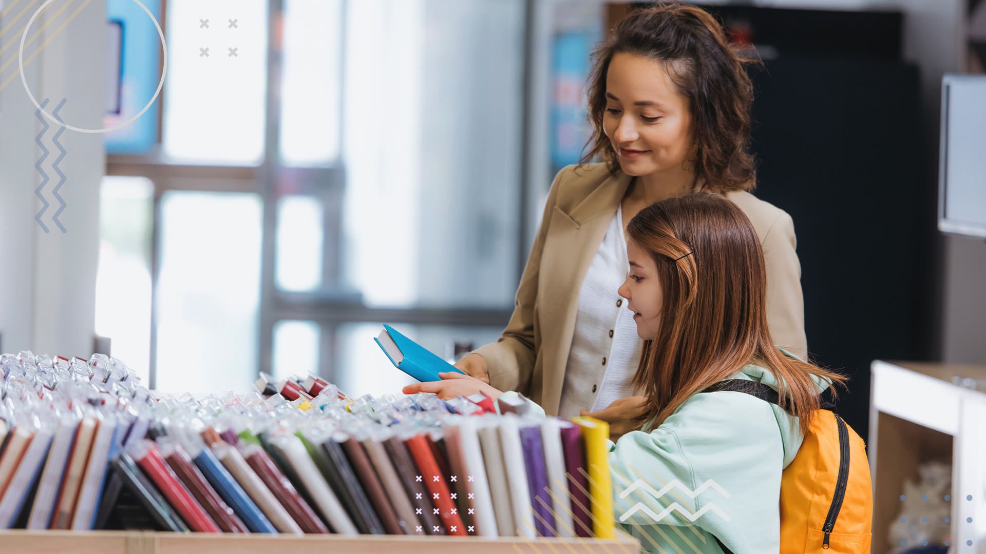 PTA and student reading book in library