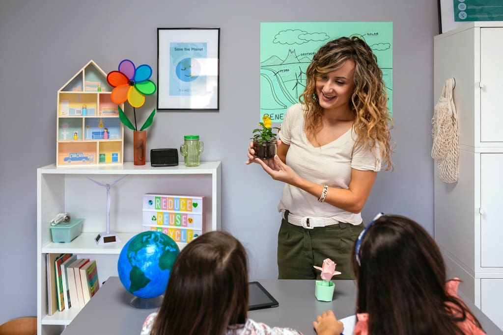 Teacher holding classroom plant gift