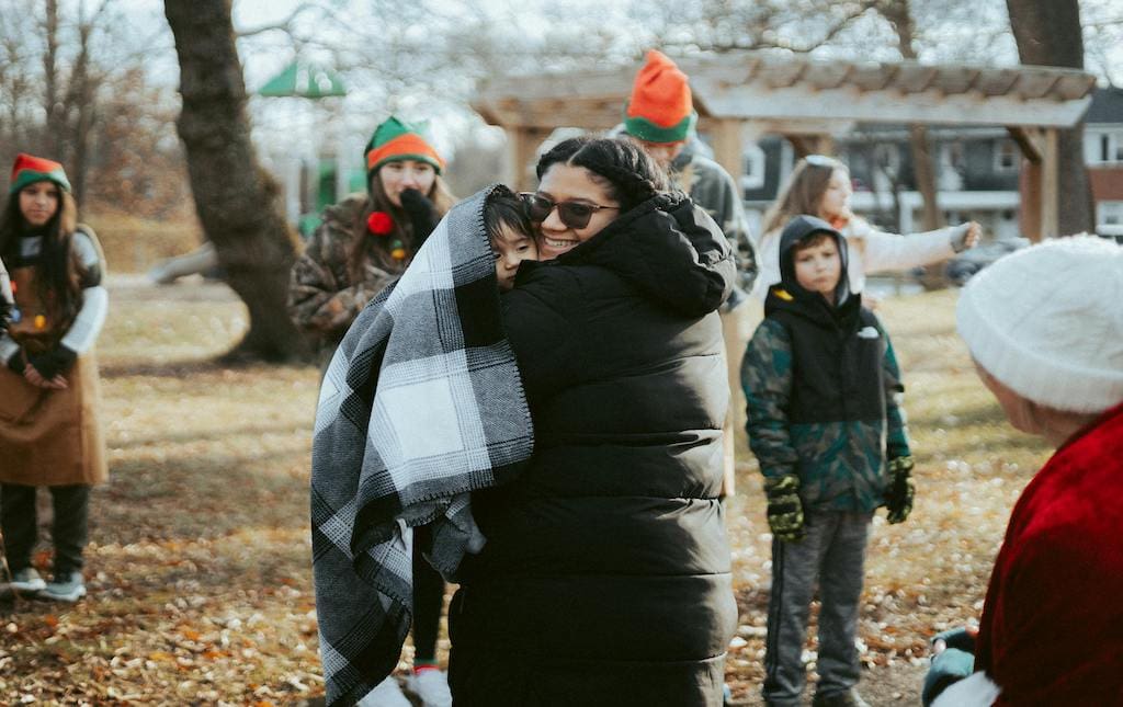 Volunteers standing together and hugging