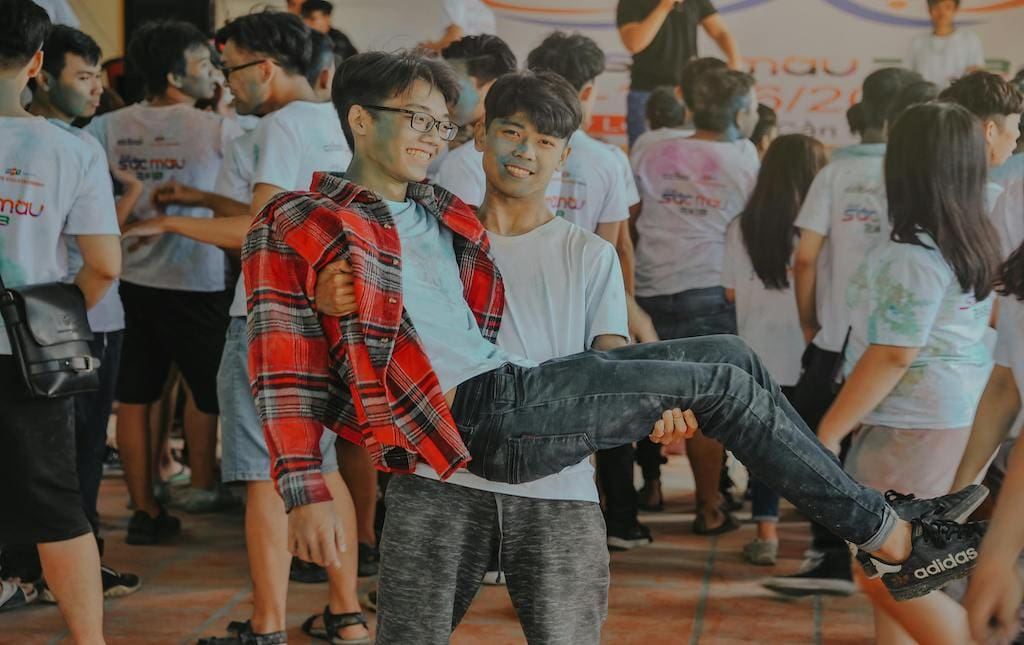 Young people celebrating during a color run