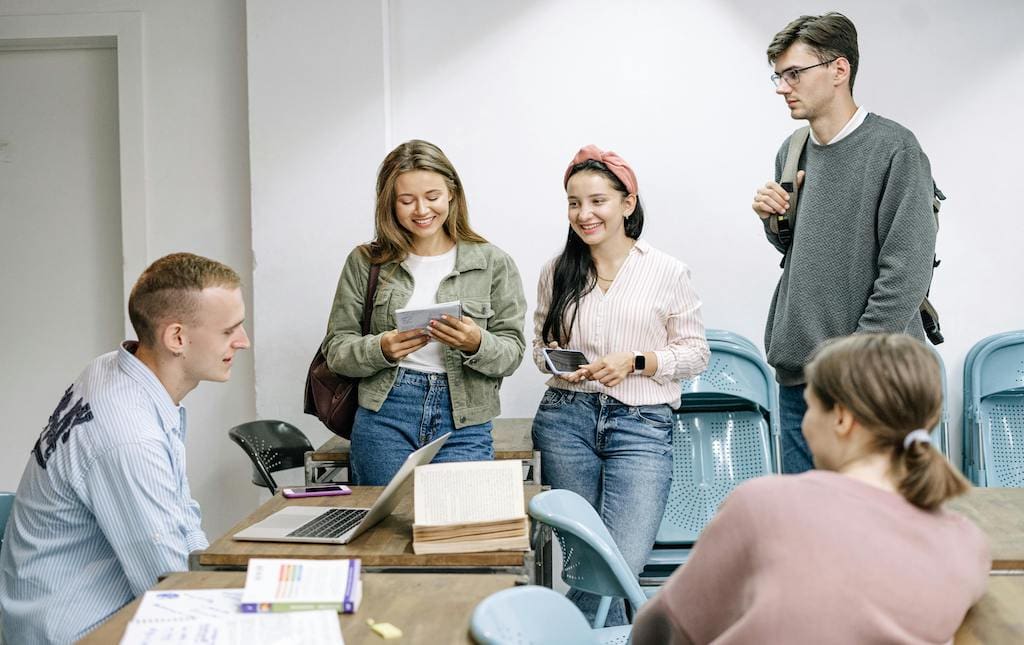 Group of young people talking and planning together