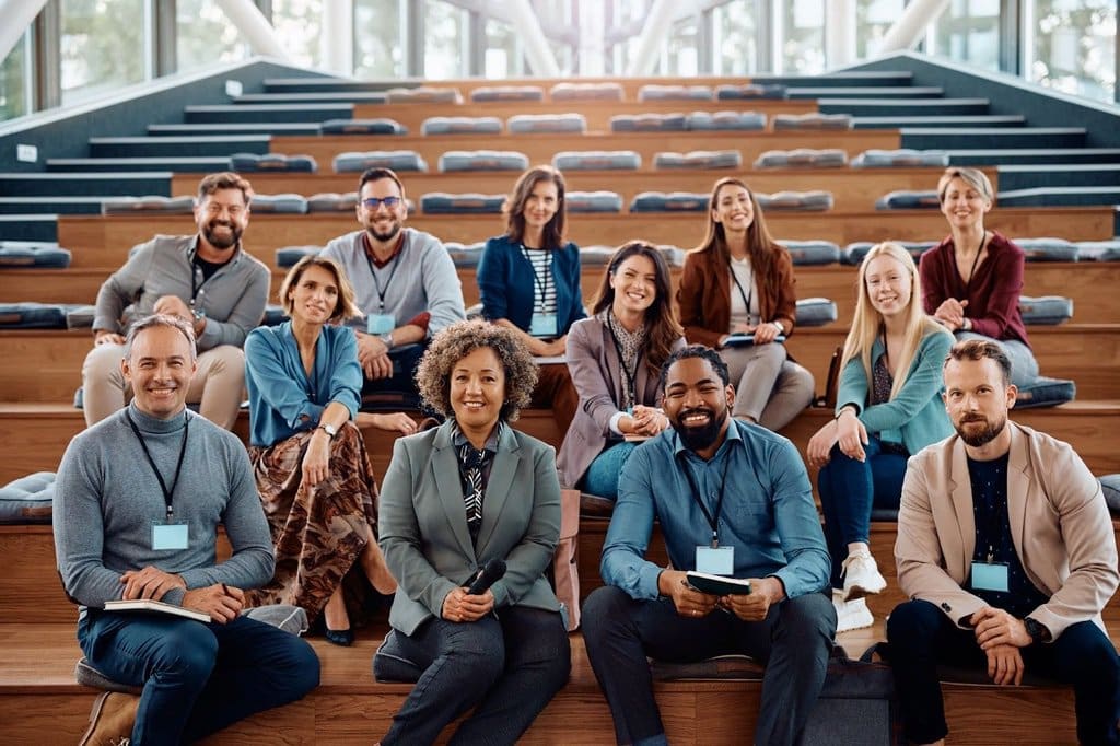 Members of professional association smiling after using Kickstarter for successful fundraising campaign