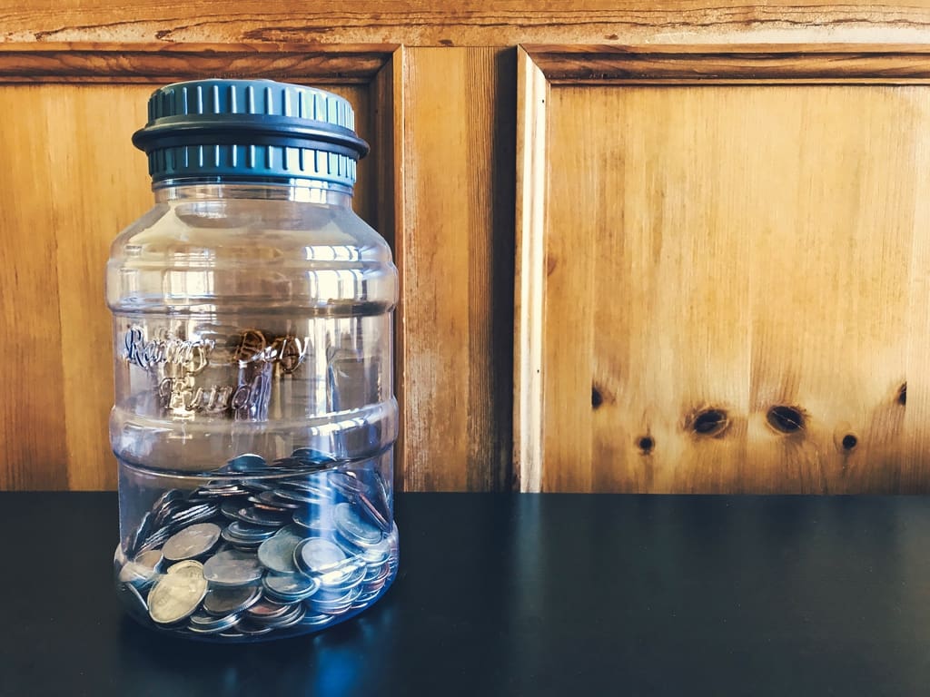 Jar of pennies in school classroom