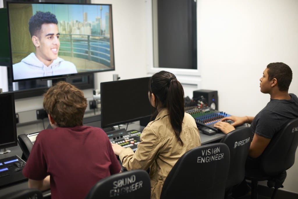 Students editing fundraiser hype video