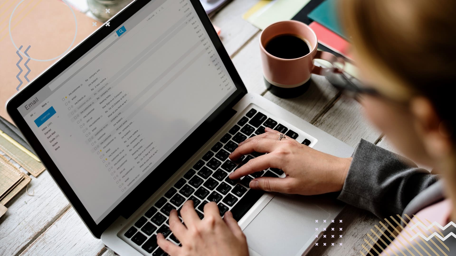 Person working in a document on laptop with coffee on table